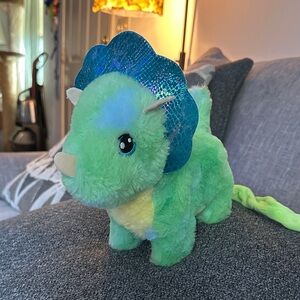 Plush dinosaur that walks roars and moves